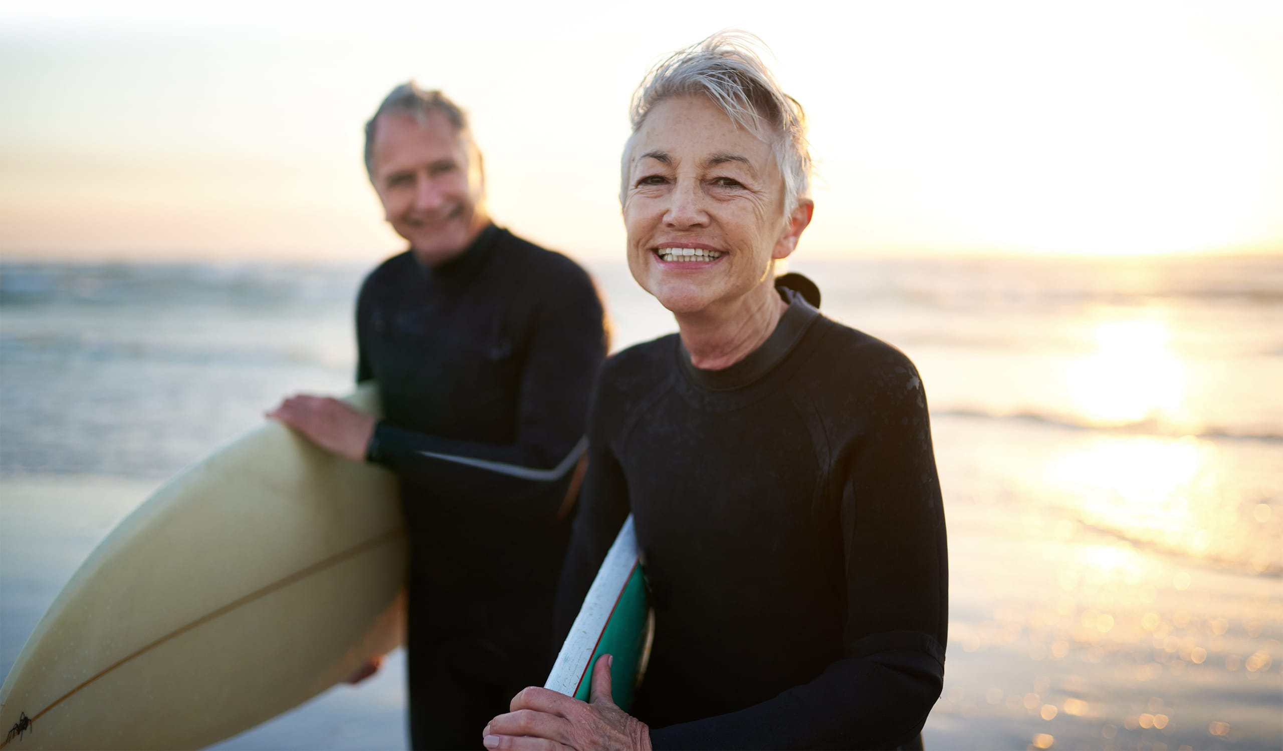 Healthy Senior Couple Surfing